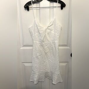 NICKILAM Women’s White Eyelet Detail Sleeveless V-Neck Ruffle Hem Mini Dress